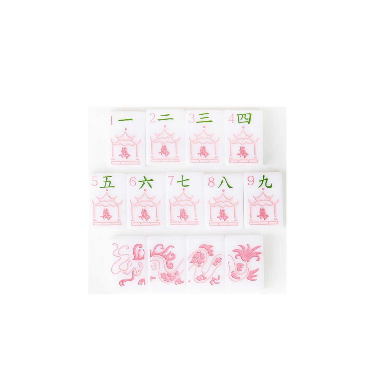 Close-up of hand-painted crak suit tiles and red dragons from the Dear Mahjong Original White mahjong set